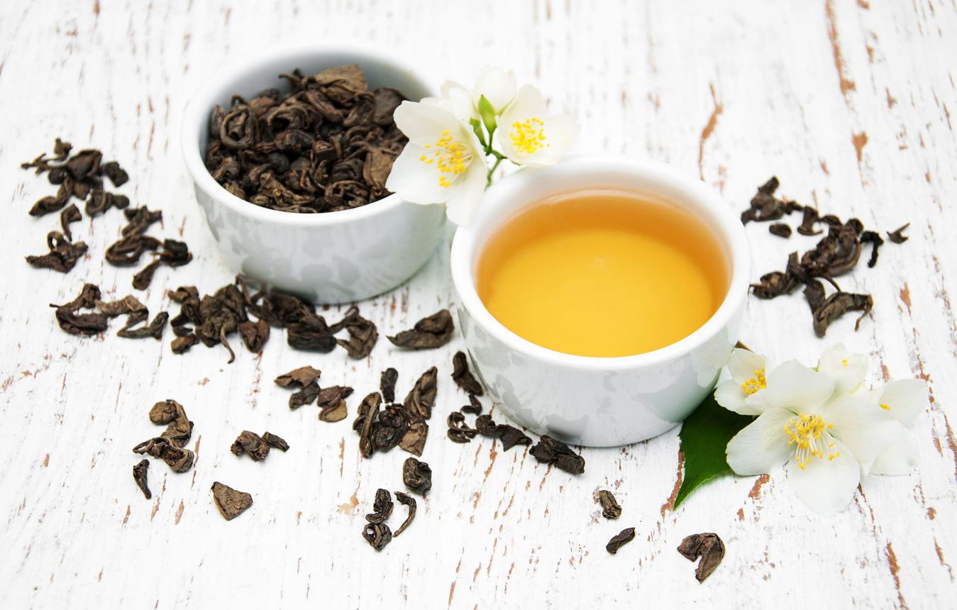 Cup of tea with jasmine flowers
